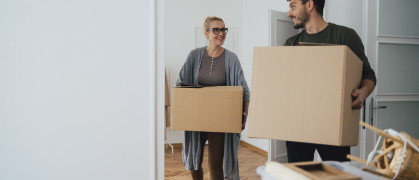 A couple with moving boxes